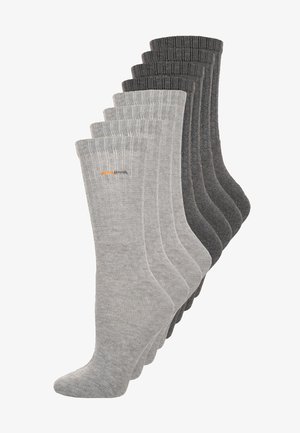 Pakke med 10 bomuldsstrømper i forskellige nuancer af grå. Hver strømpe har en ribbet kant og diskret branding i orange, med en glat tekstur.