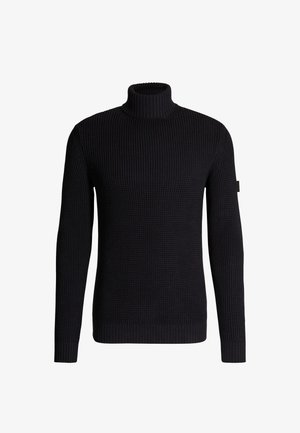 Zwarte, geribbelde gebreide turtleneck trui met lange mouwen en een aansluitende zoom. Heeft een subtiele textuur en een logo-label op de zijkant.