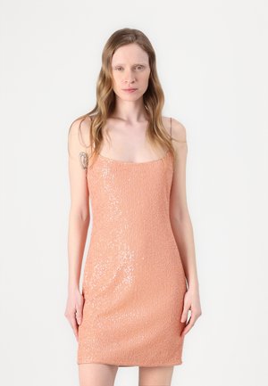 Short sequined dress in light peach. Features thin straps, a square neckline, and a fitted silhouette with a textured, shimmering finish.