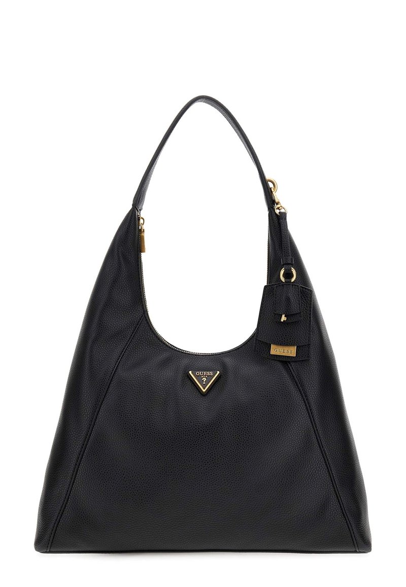 Sac en cuir noir avec une finition texturée, arborant un logo triangulaire doré, une fermeture zippée sur le dessus et une étiquette mini attachée.