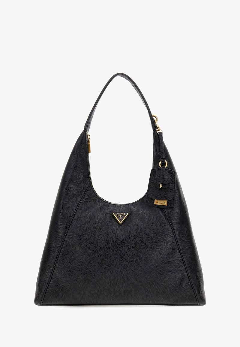 Sac en cuir noir avec une finition texturée, arborant un logo triangulaire doré, une fermeture zippée sur le dessus et une étiquette mini attachée.