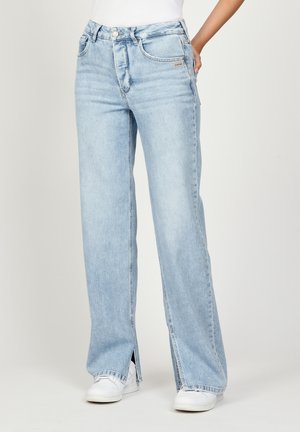 Light blue denim jeans with a wide-leg design and front slits at the hem. Features standard five-pocket styling and a button closure.