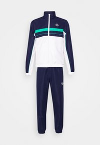Track suit featuring a zip-up jacket with navy, white, and teal color panels, and matching navy pants with an elastic waistband and logo.