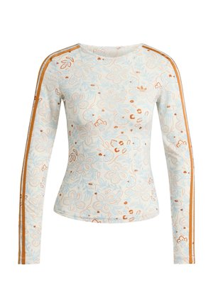 Chemise ajustée à manches longues avec motifs floraux bleu clair et marron et rayures orange courant le long des manches sur fond blanc.