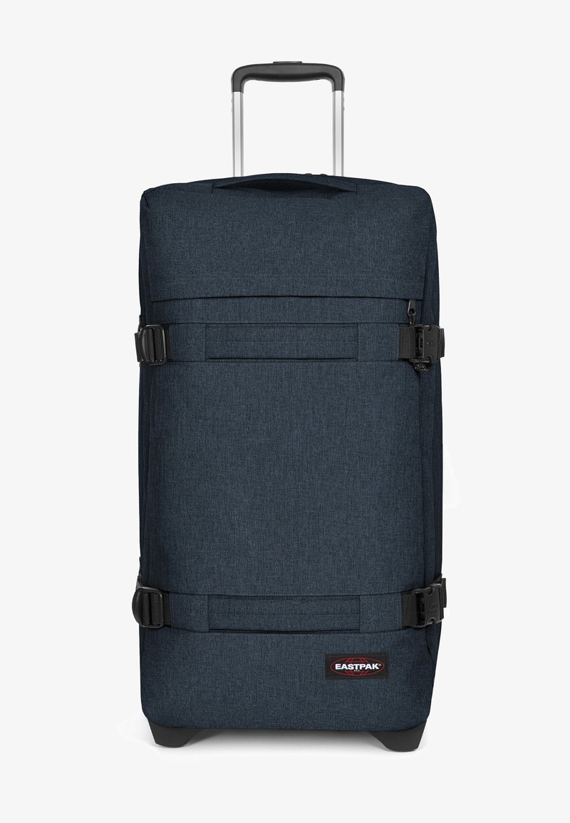 Námořnická textilní taška s kolečky, nastavovacími popruhy, teleskopickou rukojetí, pevnou základnou a logem na boku.