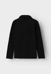 Polo a maniche lunghe nera con colletto classico e una texture liscia e uniforme. Nessun motivo o abbellimento visibile.