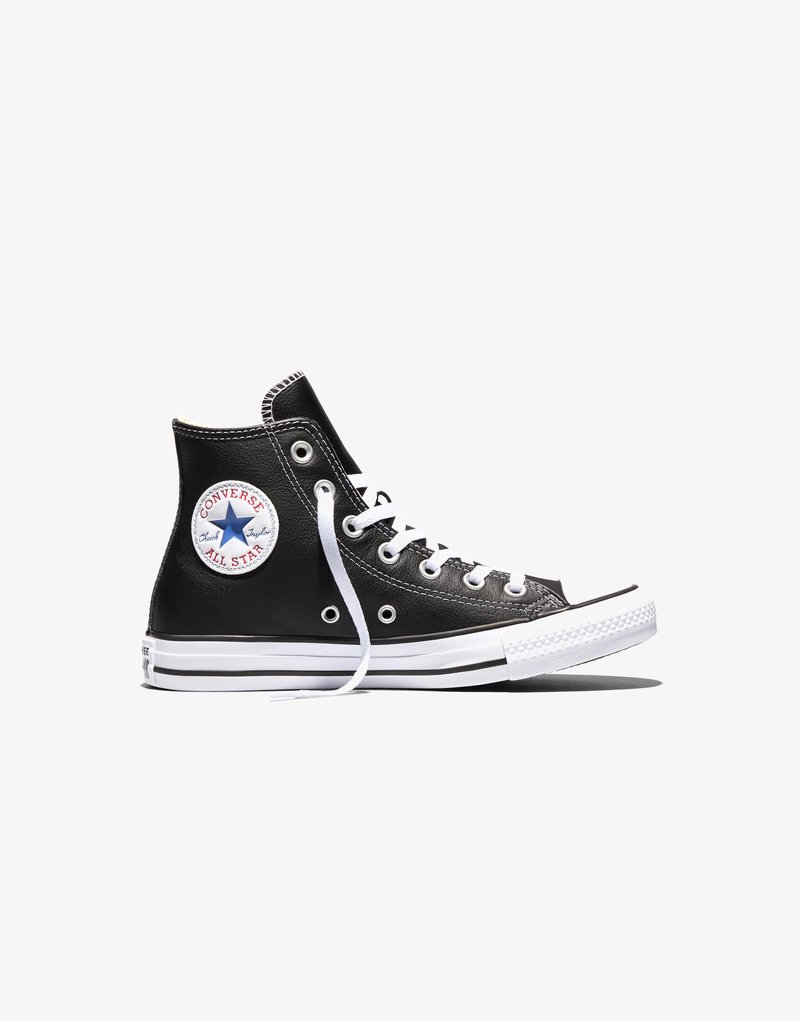 Black high-top Converse All Star sneaker with white laces, rubber sole, and logo patch on ankle against white background.