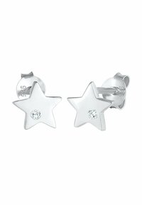 Pendientes en forma de estrella de plata con un acabado pulido, que presentan un cristal transparente incrustado en el centro de cada estrella.