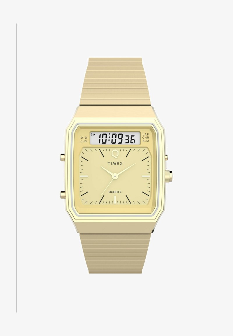 Orologio Timex al quarzo con cassa quadrata dorata, display digitale e bracciale in metallo dorato texturizzato. Presenta indicatori delle ore e dei minuti.