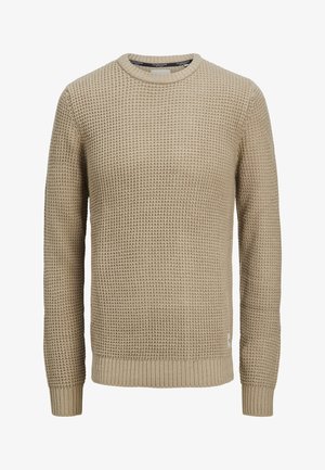 Beige genser med lange ermer og strukturert vaffelmønster, rund hals og ribbestrikkede mansjetter og kant.