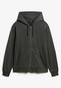 Sudadera gris con cremallera hecha de tela suave, que presenta un bolsillo frontal, cordones ajustables y un pequeño parche de logo cerca del bolsillo.