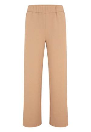 Pantaloni beige a gamba larga realizzati in un tessuto morbido e elastico. Presentano una vita elasticizzata e una superficie liscia e uniforme senza alcun motivo visibile.