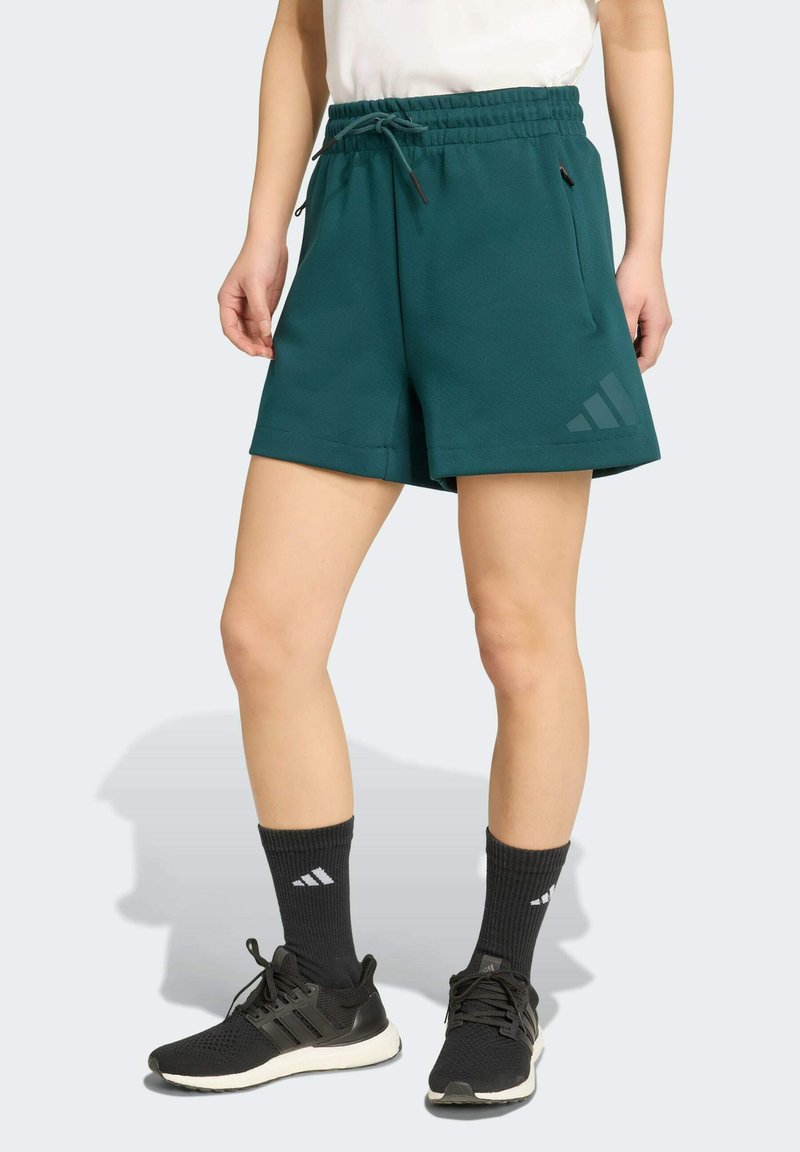 Teal active shorts with an elastic waistband and drawstring, featuring side pockets and a three-stripe logo on the left leg.