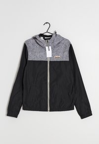 Black and gray hooded jacket with a zip front, featuring a textured gray upper, smooth black lower, and two side pockets.