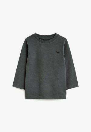 Chemise à manches longues gris foncé en tissu texturé avec un col rond et un petit logo noir sur la poitrine. Dotée de poignets et d'un ourlet côtelés.