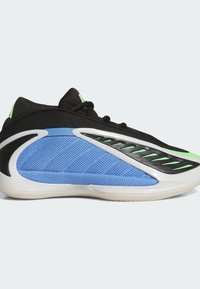 Czarne sneakersy z niebieską siateczką i zielonymi akcentami. Posiadają teksturowaną powierzchnię i unikalny zakrzywiony kształt. Biała podeszwa dodaje kontrastu.