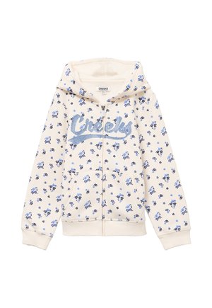 Sweat à capuche crème avec motif floral bleu, fermeture éclair devant, poches kangourou, et texte scintillant "Creeks" sur la poitrine.