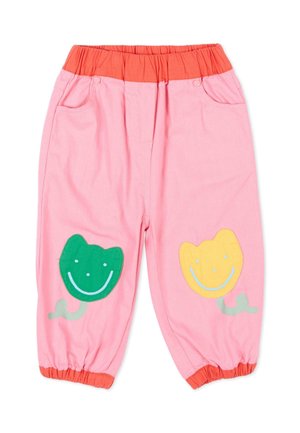 Pantaloni rosa per bambini con fascia elastica arancione in vita e polsini, decorati con toppe di fiori verdi e gialli sorridenti sulle ginocchia.