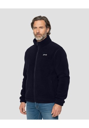 Granatowa polarowa kurtka z wysokim kołnierzem, pełnym zamkiem błyskawicznym, bocznymi kieszeniami i teksturowaną powierzchnią. Posiada małe logo na piersi.