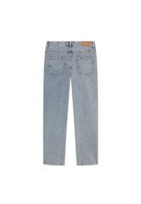 Light blue denim jeans feature a straight-leg design, five-pocket style, and a tan leather patch on the waistband. Classic stitching detail.