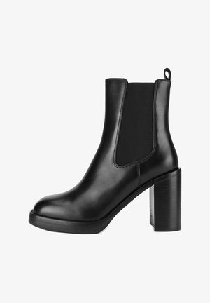 Schwarzer Leder-Stiefelette mit elastischen Seitenteilen, Zuglasche hinten und klobigem Blockabsatz.