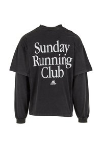 Czarny, długi rękaw, bawełniany t-shirt z dużym białym napisem "Sunday Running Club" na plecach i małym logo z przodu.