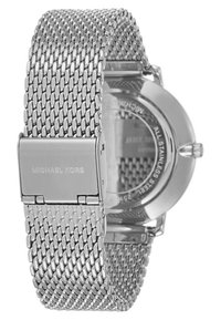 Silver stainless steel watch with a mesh band. Features a round case and a clasp engraved with "Michael Kors." Back displays a textured design.
