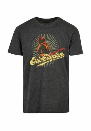 Grijze katoenen t-shirt met een afbeelding van een muzikant met een gitaar, omringd door een stralend ontwerp, en de naam "Eric Clapton" in het geel.