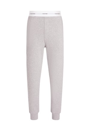 Light grey cotton joggers with elastic waistband and ribbed cuffs. Features a white branded band at the waist, smooth texture throughout.