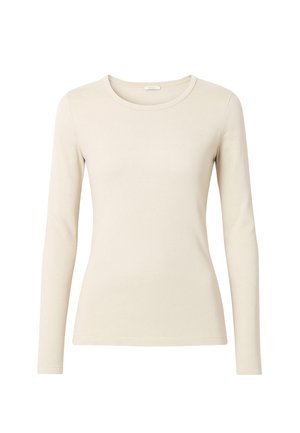 Top beige a maniche lunghe realizzato in tessuto morbido, con scollatura rotonda e design aderente. La cucitura senza soluzione di continuità lungo i bordi esalta la silhouette.