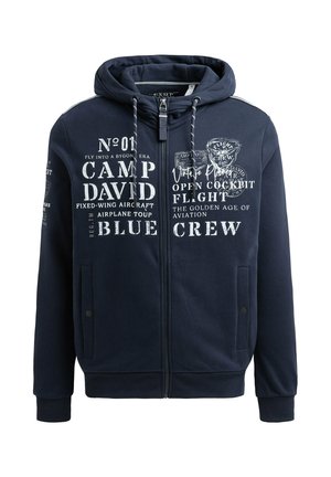 Veste à zip marine en tissu doux, ornée degraphismes sur le thème de l'aviation imprimés en blanc, avec des poches avant et une capuche avec cordon de serrage.
