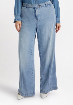 Helle blaue weit geschnittene Jeans aus Denim, mit Knopfverschluss und dezentem Verblassen, gesteppten Säumen und lässiger Passform.