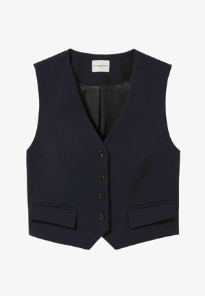 Gilet bleu marine avec un col en V, cinq boutons et deux poches à rabat à l'avant. Étiquette marquée "CLAUDIE PIERLOT" à l'intérieur.