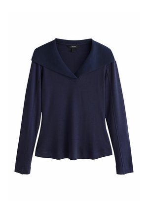 Navy long-sleeve top with a wide shawl collar, v-neckline, and a relaxed fit. Made from a soft, textured fabric with stitched seams.