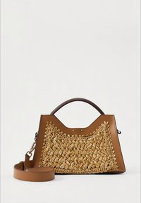Brown leather handbag with a woven straw front, featuring a structured design, top handle, and detachable shoulder strap.