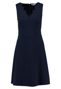 Mörkblå ärmlös klänning med en scalloped halsringning och en figurnära liv, som svänger ut i en kjol. Dragkedja på baksidan.