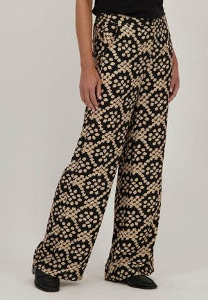 Zwarte wijde broek met een beige bloemenpatroon, soepel materiaal, hoge tailleband en een relaxte pasvorm.