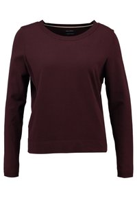 Sweat-shirt bordeaux à manches longues avec un col rond. Confectionné en tissu doux, doté de poignets côtelés et d'une coupe décontractée. Aucun motif marqué.