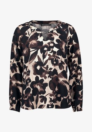 Bluzka z długim rękawem z kwiatowym wzorem w kolorze czarnym i brązowym na beżowym tle. Materiał wydaje się gładki z elastycznymi mankietami. Dekolt w kształcie litery V.