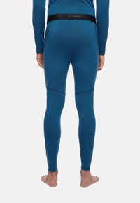 Leggings termici blu realizzati in materiale morbido e stretch. Presentano una ampia vita nera con il brand e cuciture a contrasto sui pannelli delle gambe.