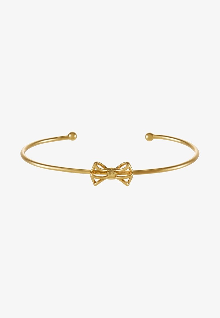 Bracelet jonc ouvert fin en or avec un petit nœud en or détaillé au centre et des extrémités arrondies.