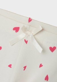 Baumwollleggings mit einem cremigen Hintergrund, verziert mit verstreuten rosa Herzmustern und einer weißen Schleifenbinde am Bund.