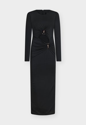 Schwarzes Langarmkleid mit figurbetonter Silhouette, gerafften Stoffdetails an der Taille und zwei runden metallischen Akzenten. Reißverschluss am Rücken.