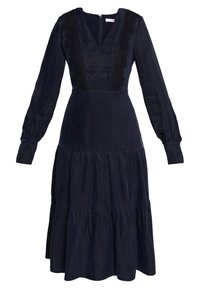 Marinblå klänning i mjuk tyg, med lång ärm, V-ringning och intrikata svarta broderier längs bodicen. Lagererad kjol.