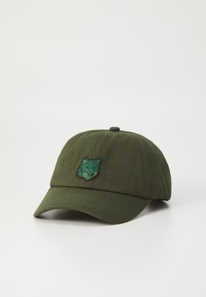 Dark green baseball cap made of cotton with a front embroidered fox design in contrasting green. Features a curved brim and adjustable strap.