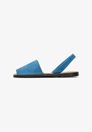 Blue leather slingback sandal with a smooth finish, open toe design, and flat black sole, featuring minimal stitching accents.