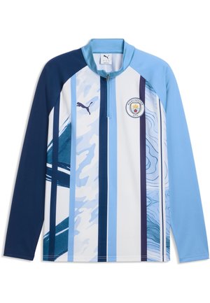 Top deportivo de manga larga del Manchester City con rayas verticales azules y blancas, cuello con cremallera hasta la mitad, logotipo de Puma y escudo del club en el pecho.