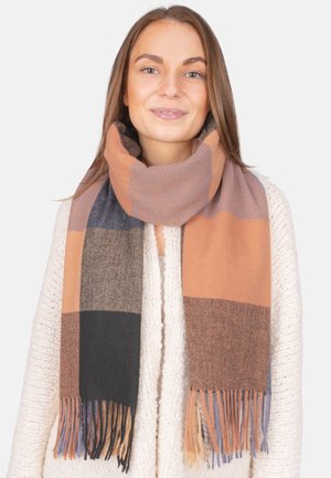 Plaid scarf in shades of orange, brown, and black, made of soft fabric with fringe edges, wrapped around the neck.