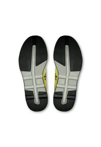 Black and gray athletic shoe soles with yellow accents, featuring a textured pattern and distinct segmented design for enhanced traction.