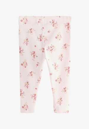 Hele-roosad soonikuldsed retuusid, millel on lillemuster roosa, oranži ja kollase toonides ning mugava elastse vöökohaga.